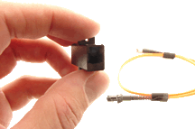 Front view of a hand holding a MTRJ Adapter Panel Connector